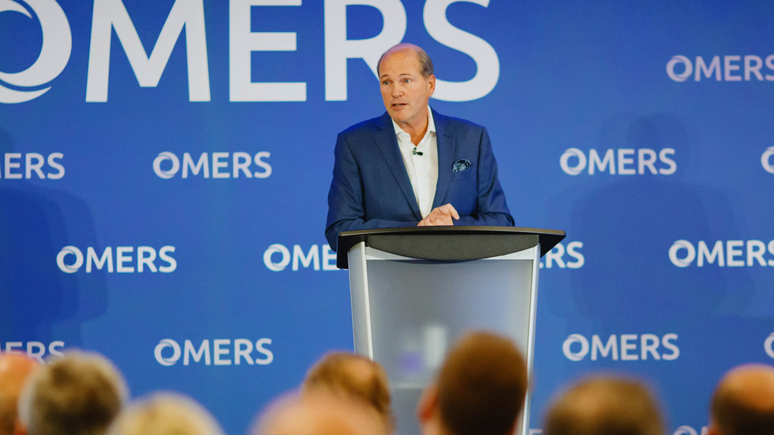 OMERS CEO Blake Hutchenson speaking at an event featuring OMERS step and repeat branding